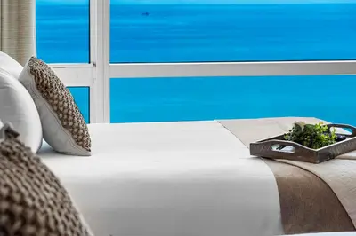 a white bed with a tray of plants on it at 2 Bedroom Private Residence at Carillon Miami Resort -522 in Miami Beach