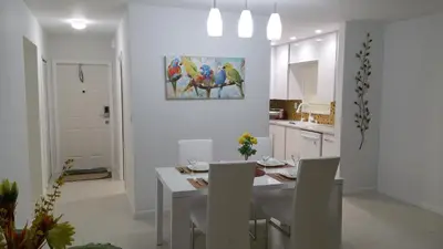 a kitchen and dining room with a table and chairs at Downtown Hollywood Boutique Hotel in Hollywood
