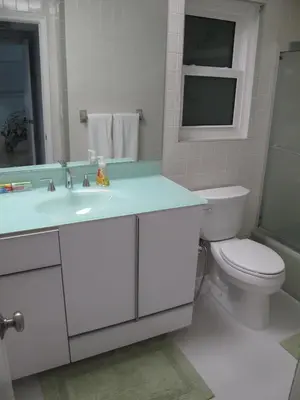 a bathroom with a sink and a toilet and a mirror at Downtown Hollywood Boutique Hotel in Hollywood