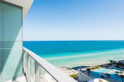 a view of the beach from the balcony of a building at Breathtaking Ocean-View Balcony Lyfe Resort in Hollywood Beach