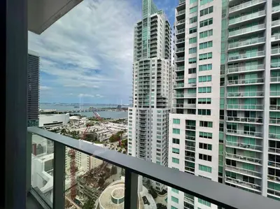 a view from the balcony of a building with tall buildings at Spacious Studio in the Heart of Downtown Miami in Miami