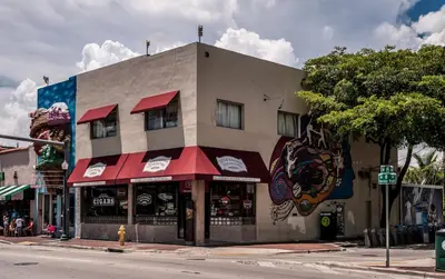 a building on the corner of a street at Coco Sol 3 by MyMiamiStay in Miami