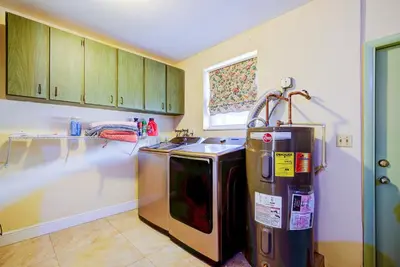a kitchen with a stove and a refrigerator at Classic Modern 3-Bedroom Oasis in Fort Lauderdale