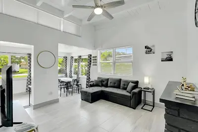 a living room with a couch and a table at Fort Lauderdale Home near Nightlife and Beach in Fort Lauderdale