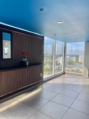 a large room with large windows in a building at 2 Bed 2 Bath With Amazing Bay View And Luxury Pool in Hallandale Beach