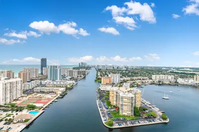 an aerial view of a city with a river at Beachwalk Family Studio- Beach Pool Gym & Bay View in Hallandale Beach