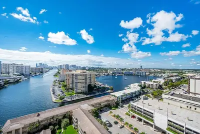 an aerial view of a river with buildings and a city at Beachwalk Family Studio- Beach Pool Gym & Bay View in Hallandale Beach