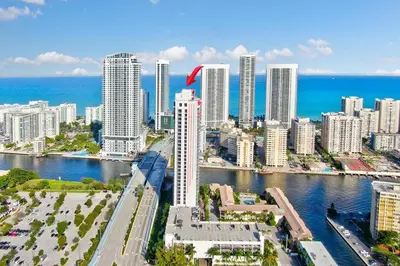 an aerial view of a city with buildings and the ocean at Beachwalk Family Studio- Beach Pool Gym & Bay View in Hallandale Beach