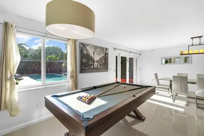 a billiard room with a pool table in it at Spacious 3 bedroom Home with Oversized Pool & Backyard in Miami