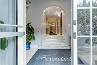 an open door to a hallway with stairs at S BEACH SPOT Heated pool 2BLOCKs to BEACH BBQ in Miami Beach