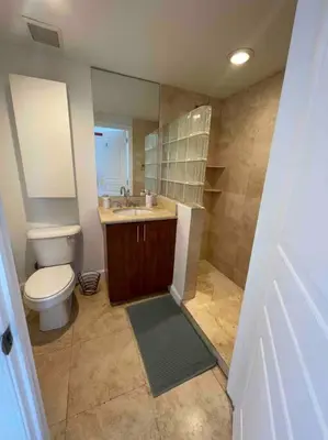 a bathroom with a toilet and a sink at S BEACH SPOT Heated pool 2BLOCKs to BEACH BBQ in Miami Beach