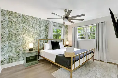 a bedroom with a bed and a ceiling fan at Fort Lauderdale Tropical Oasis Pool Retreat in Fort Lauderdale