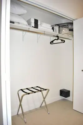 a room with a shelf and a chair in a room at Comfortable Studio suites in downtown Doral in Miami