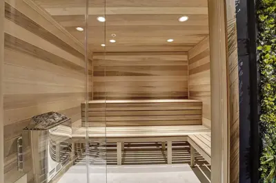 a sauna with a bench in a wooden wall at High Floor Adorable 2 Bedroom Condo Resort 1606 in Miami Beach