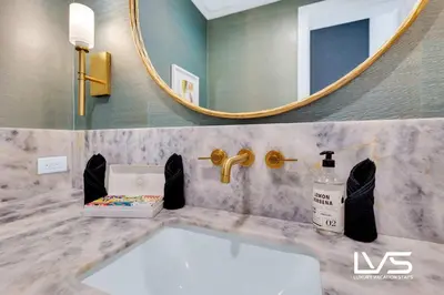 a bathroom with a sink and a mirror at Carlotta- New Construction Luxury Waterfront Villa in Fort Lauderdale