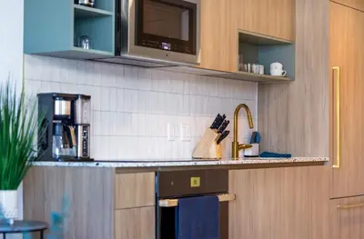 a kitchen with a sink and a counter top at Upscale 1-BD Condo with Stunning City Views in Miami