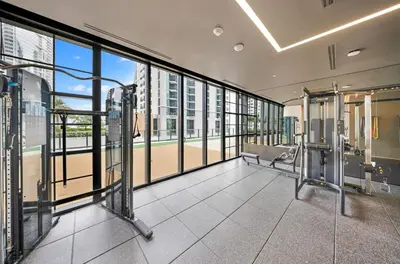 an empty gym with large windows in a building at Upscale 1-BD Condo with Stunning City Views in Miami