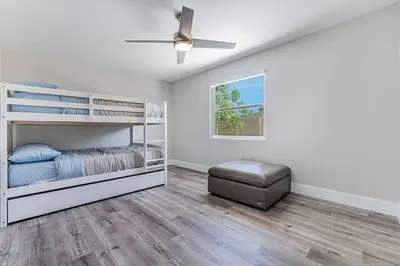 a bedroom with two bunk beds and a ceiling fan at Miami Modern Oasis Retreat - Close to Airport in Miami