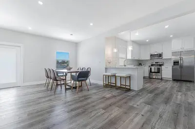 a kitchen and dining room with a table and chairs at Miami Modern Oasis Retreat - Close to Airport in Miami