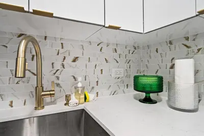 a kitchen counter with a sink and a faucet at Palms 811 in Miami Beach