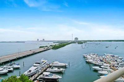a bunch of boats are docked in a harbor at Palms 811 in Miami Beach