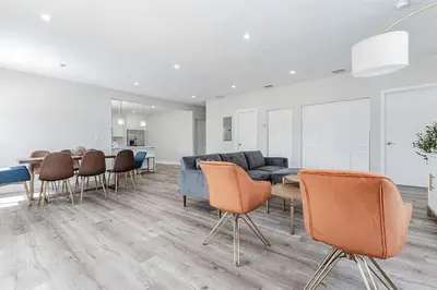 a living room with a couch and a table and chairs at Modern Miami Unit 1 - Close to South Beach & Airport in Miami