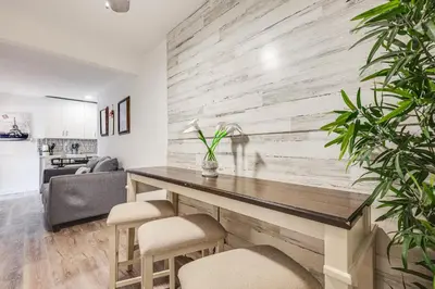 a living room with a dining table and chairs at Hollywood Hideaway Close to Dtwn and Beaches in Hollywood