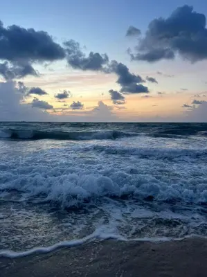 a view of the ocean with waves on the beach at Hollywood Townhouse steps to beach and famous Broadwalk in Hollywood Beach