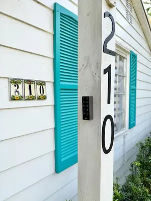 a house with blue shutters on a house at Melrose Villa in Miami