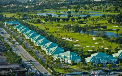 an aerial view of a resort with a golf course at Doral Pool 310 by WaveProperties in Miami