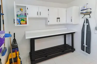 a kitchen with a white counter and white cabinets at CasaBay 4 Bed 2 Bath House Ultimate Backyard Fun in Cutler Bay