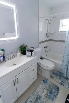 a bathroom with a toilet and a sink and a shower at CasaBay 4 Bed 2 Bath House Ultimate Backyard Fun in Cutler Bay