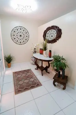 a room with a table and plants on the wall at CasaBay 4 Bed 2 Bath House Ultimate Backyard Fun in Cutler Bay