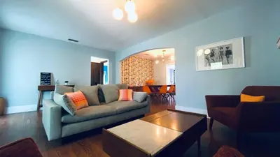 a living room with a couch and a table at Experience Miami Magic: Tropical Pool Escape in Miami