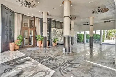 a large room with columns and a lobby with plants at 1100 West South Beach Lux Waterfront Studio in Miami Beach