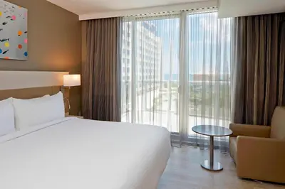 a hotel room with a bed and a large window at AC Hotel by Marriott Miami Beach in Miami Beach