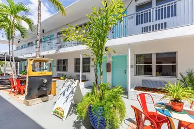 a house with a table and chairs in front of it at Seaside All Suites Hotel in Miami Beach