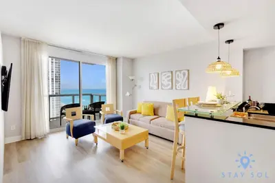 a living room with a couch and a table at 1BR Apartment with beautiful view in Sunny Isles Beach