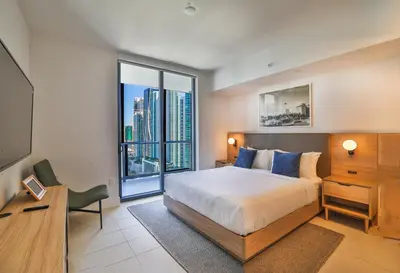 a bedroom with a bed and a large window at Stunning 2 Bed 2 Bath w balcony & incredible views in Miami
