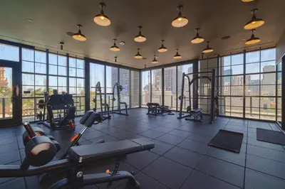 a gym with a lot of exercise equipment and windows at Stunning 2 Bed 2 Bath w balcony & incredible views in Miami