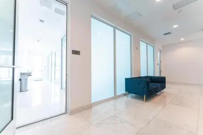 a black couch in a room with large windows at Lux 3BR City-View Retreat in Hollywood, 5th Floor in Hollywood