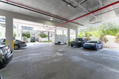 a garage with several cars parked in it at Lux 3BR City-View Retreat in Hollywood, 5th Floor in Hollywood