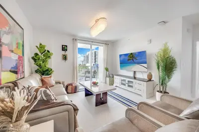a living room with two couches and a tv at Lux 3BR City-View Retreat in Hollywood, 5th Floor in Hollywood