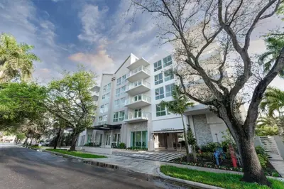 a white building on a street with trees at Lux 3BR City-View Retreat in Hollywood, 5th Floor in Hollywood