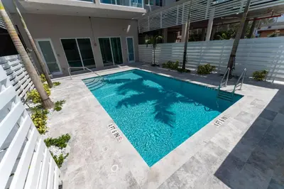 a swimming pool in front of a building at Lux 3BR City-View Retreat in Hollywood, 5th Floor in Hollywood