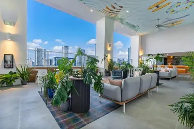 a living room with a couch and plants at 2 bedrooms Design Condo Downtown Miami Pool and Gym in Miami