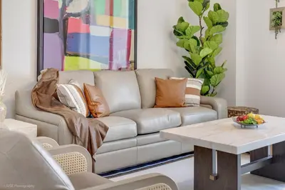 a living room with a couch and a table at Lux 3BR City-View Retreat in Hollywood, 4th Floor in Hollywood