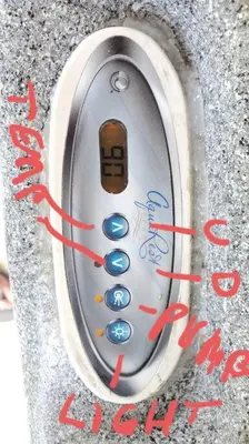 a close up of a remote control in a wall at Beach Lake Paradise - Super Location! in Fort Lauderdale