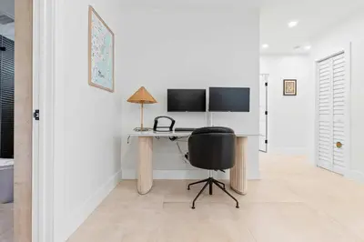 a home office with a desk and a chair at Casa Siesta- Hot tub Home Gym and Modern Design in Miami