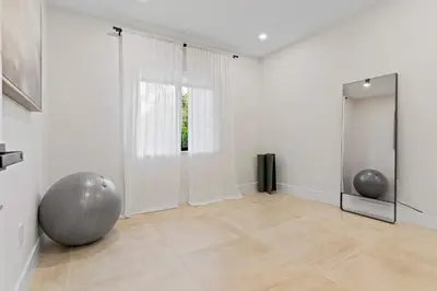 a room with a large silver ball and a mirror at Casa Siesta- Hot tub Home Gym and Modern Design in Miami